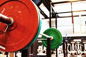 Benchpress, barbells with red and green weights