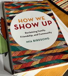Photograph of the cover of How We Show Up by Mia Birdsong