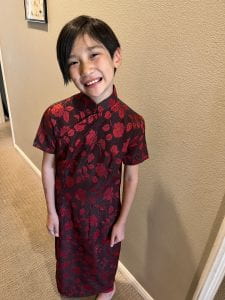 My little girl in a red qipao that belonged to my mother