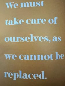 Photo of a page from Shamari K. Reid's Humans who Teach that says "We must take care of ourselves, as we cannot be replaced." 